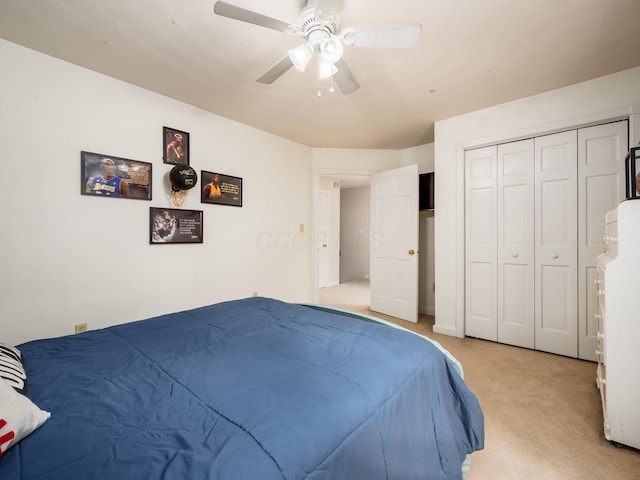 2870 Tarkman Dr, Nashport, OH 43830 - bedroom featuring light colored carpet, ceiling fan, and a closet