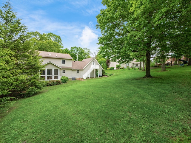 2870 Tarkman Dr, Nashport, OH 43830 - view of grassy yard featuring a sunroom