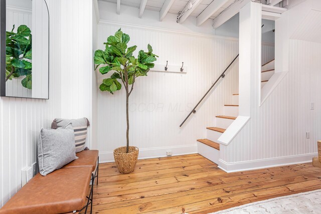 503 City Park Ave, Columbus, OH 43215 - staircase with hardwood / wood-style floors, beamed ceiling, and baseboards