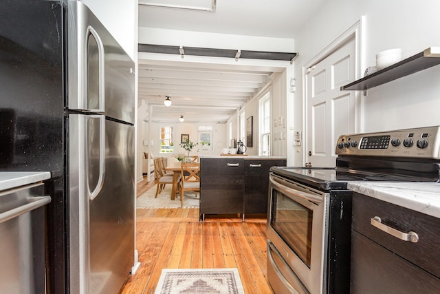 503 City Park Ave, Columbus, OH 43215 - kitchen with stainless steel appliances, dark brown cabinetry, light wood-style floors, and open shelves