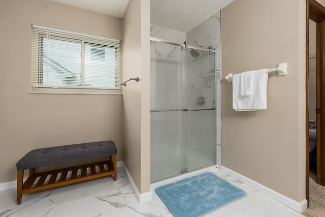 5839 Castleknock Rd, Dublin, OH 43016 - bathroom with marble finish floors, a marble finish shower, baseboards, and a textured ceiling