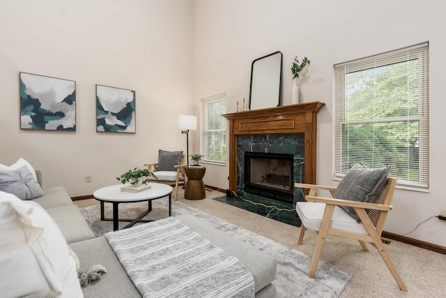 5839 Castleknock Rd, Dublin, OH 43016 - carpeted living room with a high end fireplace, baseboards, and a high ceiling