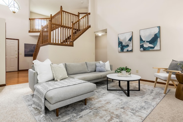 5839 Castleknock Rd, Dublin, OH 43016 - living area featuring stairs, baseboards, high vaulted ceiling, and carpet