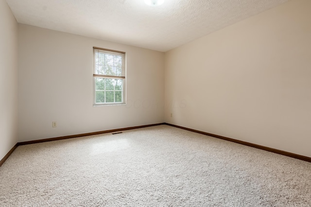 5839 Castleknock Rd, Dublin, OH 43016 - carpeted spare room featuring baseboards and a textured ceiling
