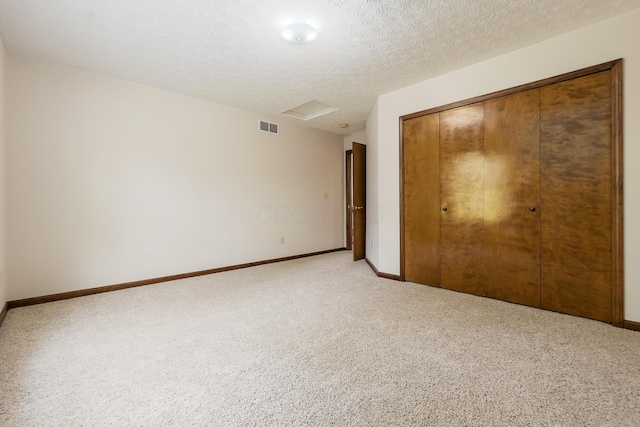 5839 Castleknock Rd, Dublin, OH 43016 - unfurnished bedroom featuring carpet flooring, baseboards, a closet, and a textured ceiling