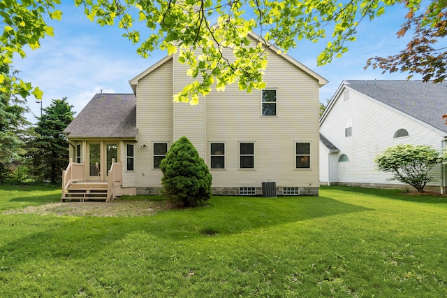 5839 Castleknock Rd, Dublin, OH 43016 - rear view of property with a lawn, central air condition unit, and a shingled roof