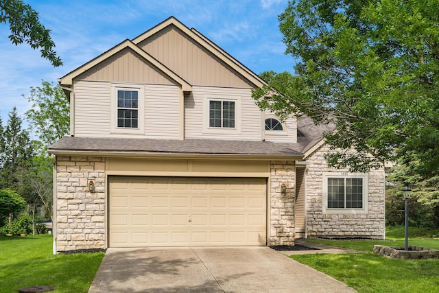 5839 Castleknock Rd, Dublin, OH 43016 - view of front of house featuring stone siding, an attached garage, a front lawn, and concrete driveway