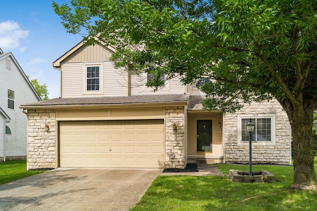5839 Castleknock Rd, Dublin, OH 43016 - view of front of property with stone siding, an attached garage, concrete driveway, a front lawn, and board and batten siding