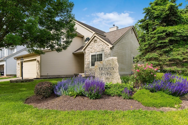 5839 Castleknock Rd, Dublin, OH 43016 - craftsman inspired home featuring stone siding, an attached garage, a chimney, and a front yard