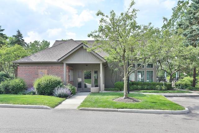 880 Village Brook Way, Columbus, OH 43235 - view of front of property with brick siding, roof with shingles, and a front yard