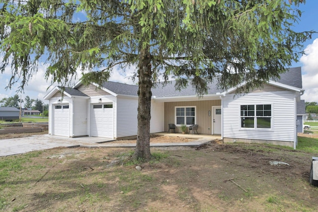 13081 Dogwood Rd NE, Thornville, OH 43076 - ranch-style home with an attached garage, driveway, and roof with shingles