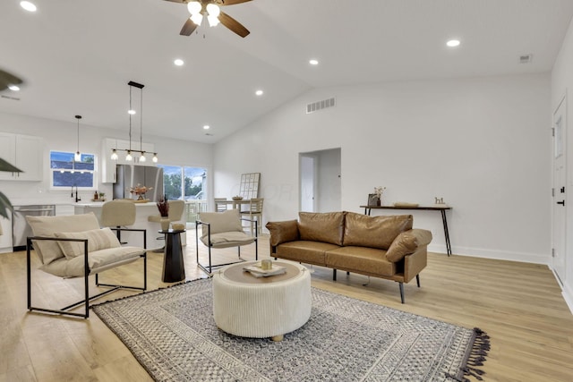 13081 Dogwood Rd NE, Thornville, OH 43076 - living area with light wood-type flooring, a ceiling fan, recessed lighting, high vaulted ceiling, and baseboards