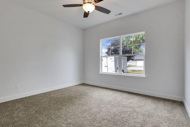 13081 Dogwood Rd NE, Thornville, OH 43076 - unfurnished room with a ceiling fan, baseboards, and carpet flooring