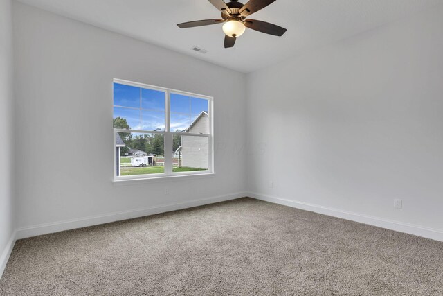 13081 Dogwood Rd NE, Thornville, OH 43076 - spare room with carpet, baseboards, and a ceiling fan