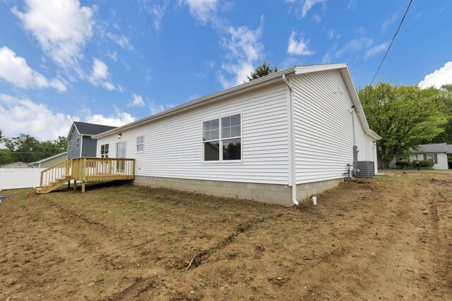 13081 Dogwood Rd NE, Thornville, OH 43076 - view of property exterior with central air condition unit and a wooden deck