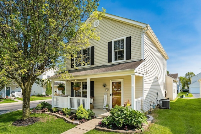 7765 Lantana Ave Unit 164, Blacklick, OH 43004 - view of front facade with covered porch, a front yard, and cooling unit