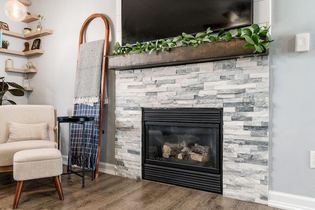 7765 Lantana Ave Unit 164, Blacklick, OH 43004 - detailed view of wood finished floors, a stone fireplace, and baseboards