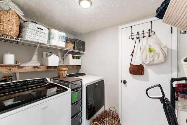 7765 Lantana Ave Unit 164, Blacklick, OH 43004 - laundry area featuring separate washer and dryer and a textured ceiling