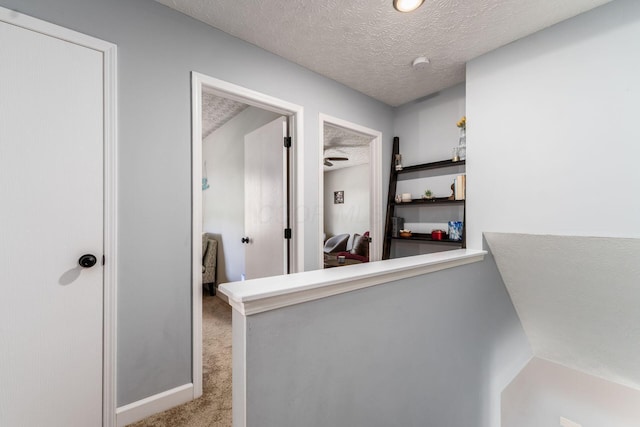 7765 Lantana Ave Unit 164, Blacklick, OH 43004 - hall featuring light carpet and a textured ceiling