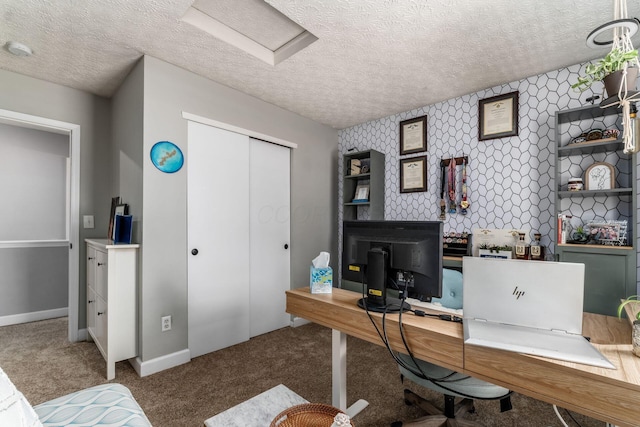 7765 Lantana Ave Unit 164, Blacklick, OH 43004 - carpeted home office with attic access, a textured ceiling, baseboards, and an accent wall
