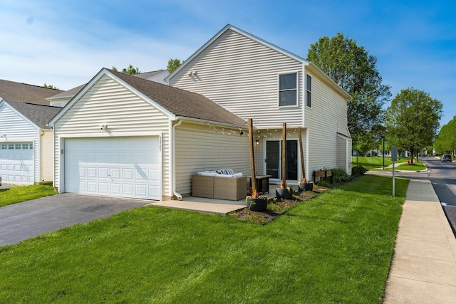7765 Lantana Ave Unit 164, Blacklick, OH 43004 - view of property exterior with a garage, asphalt driveway, a lawn, and a shingled roof