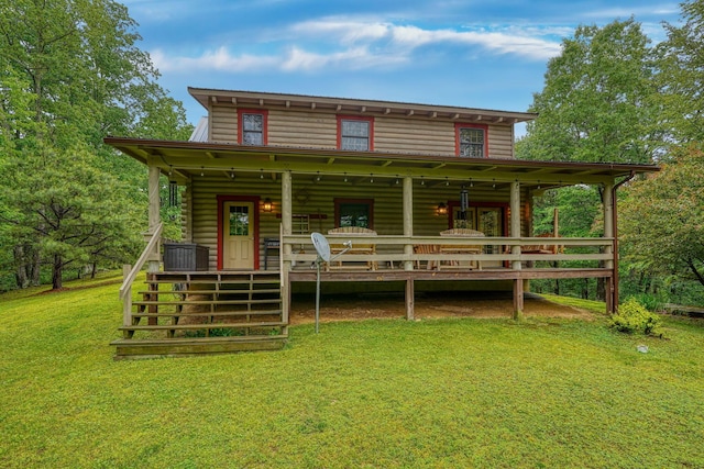 7 Whiskey Run Rd, Chillicothe, OH 45601 - back of property with a lawn and covered porch