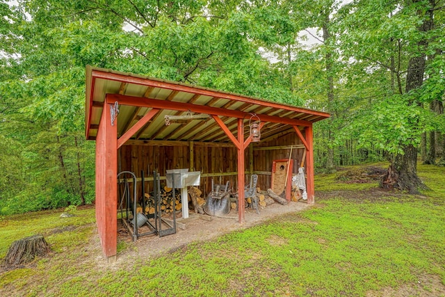 7 Whiskey Run Rd, Chillicothe, OH 45601 - view of patio with an outbuilding, an outdoor structure, and a forest view
