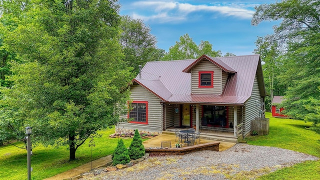 7 Whiskey Run Rd, Chillicothe, OH 45601 - view of front facade featuring metal roof, a front yard, and log siding