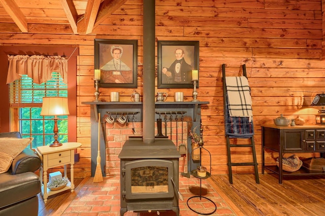 7 Whiskey Run Rd, Chillicothe, OH 45601 - sitting room with wooden walls, a wood stove, and beamed ceiling