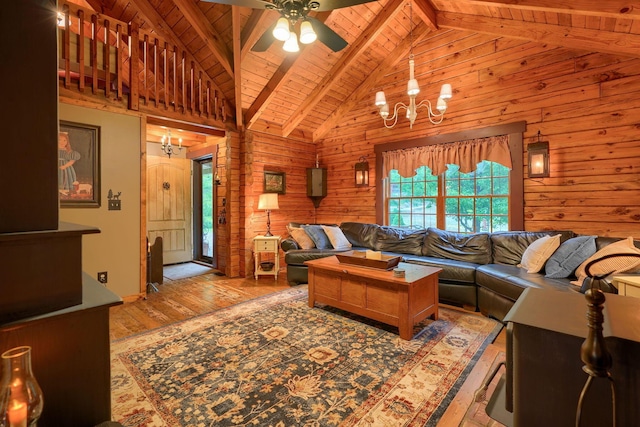7 Whiskey Run Rd, Chillicothe, OH 45601 - living area featuring a chandelier, hardwood / wood-style floors, wood walls, wood ceiling with exposed beams, and ceiling fan