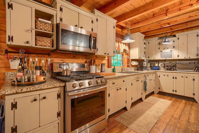 7 Whiskey Run Rd, Chillicothe, OH 45601 - kitchen with stainless steel appliances, a sink, wood ceiling with exposed beams, light countertops, and tasteful backsplash