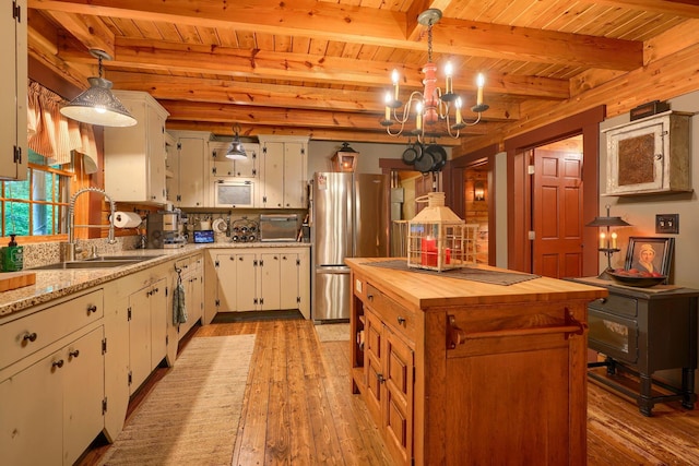7 Whiskey Run Rd, Chillicothe, OH 45601 - kitchen with a sink, freestanding refrigerator, wooden ceiling with exposed beams, butcher block counters, and light wood-type flooring