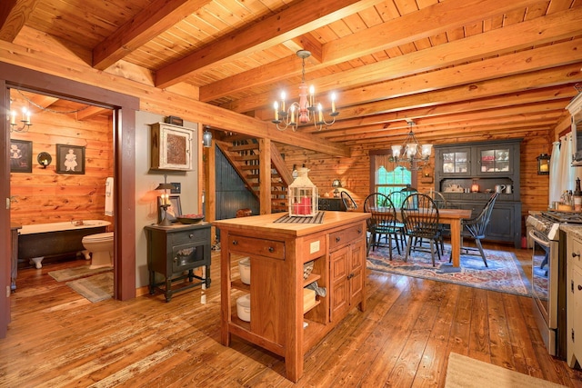 7 Whiskey Run Rd, Chillicothe, OH 45601 - kitchen with a chandelier, wood counters, gas range, wooden walls, and hardwood / wood-style floors