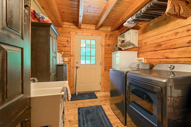 7 Whiskey Run Rd, Chillicothe, OH 45601 - laundry area featuring washer and clothes dryer, light wood-style floors, wood walls, and wood ceiling