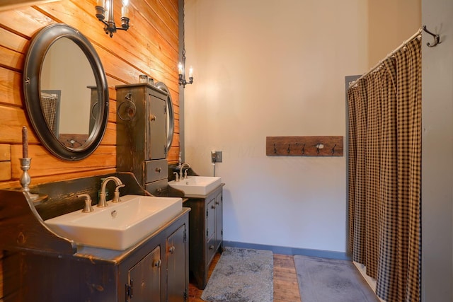 7 Whiskey Run Rd, Chillicothe, OH 45601 - bathroom with wood finished floors, two vanities, a shower with shower curtain, and wood walls