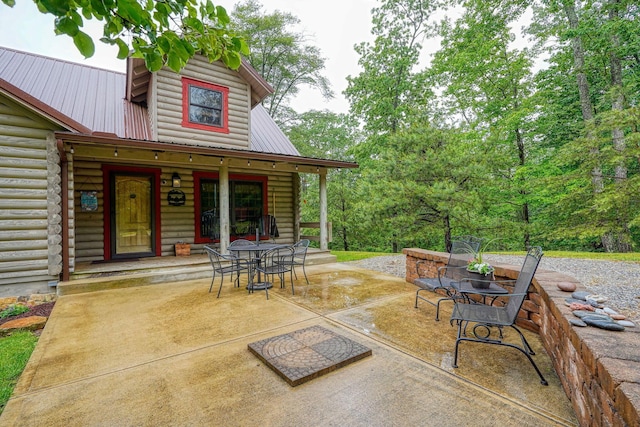7 Whiskey Run Rd, Chillicothe, OH 45601 - covered porch with outdoor dining space and a patio area