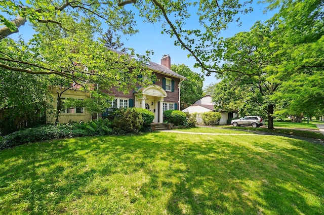 1875 King Ave, Columbus, OH 43212 - view of front facade with a chimney and a front lawn