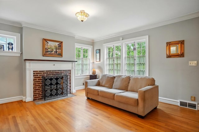1875 King Ave, Columbus, OH 43212 - living room with light wood-style floors, ornamental molding, baseboards, and a fireplace