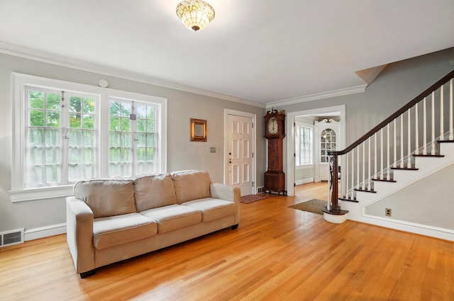 1875 King Ave, Columbus, OH 43212 - living room with healthy amount of natural light, light wood-style flooring, stairs, crown molding, and baseboards