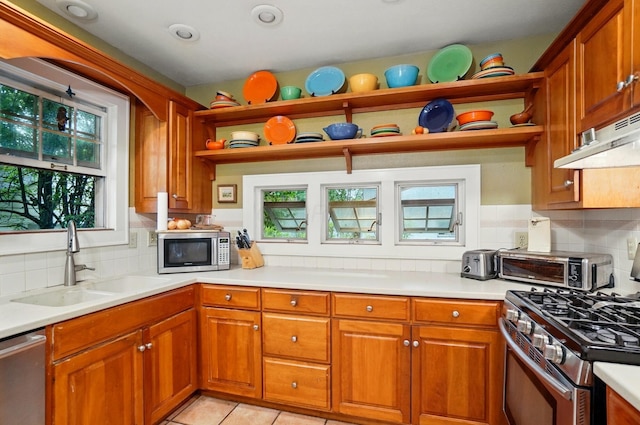 1875 King Ave, Columbus, OH 43212 - kitchen featuring open shelves, appliances with stainless steel finishes, a sink, and brown cabinets