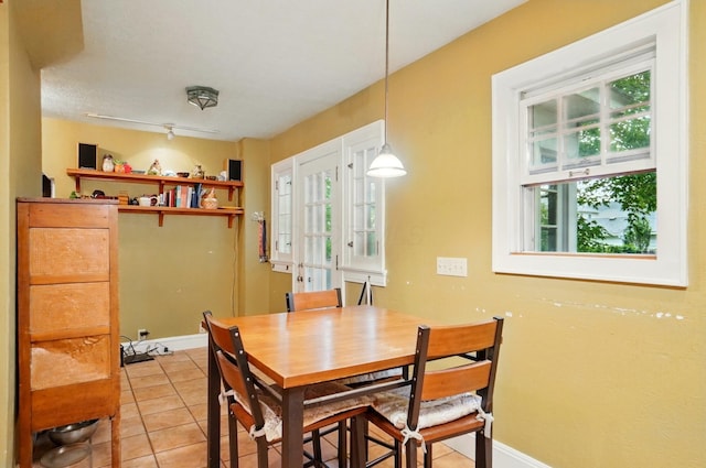 1875 King Ave, Columbus, OH 43212 - dining area with healthy amount of natural light, light tile patterned floors, and baseboards