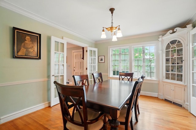 1875 King Ave, Columbus, OH 43212 - dining room with a chandelier, ornamental molding, light wood-style flooring, and baseboards