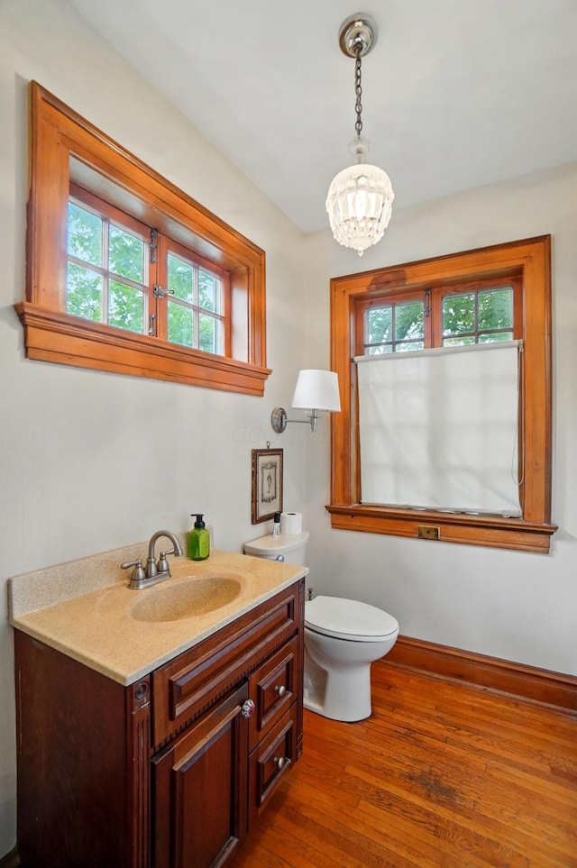 1875 King Ave, Columbus, OH 43212 - bathroom featuring plenty of natural light, vanity, wood finished floors, and a chandelier