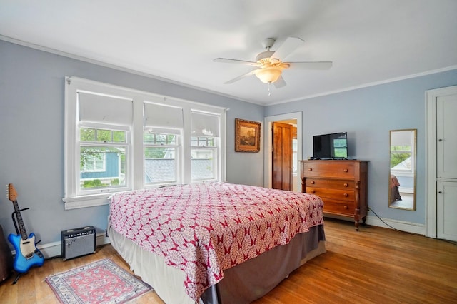 1875 King Ave, Columbus, OH 43212 - bedroom with ornamental molding, wood finished floors, and ceiling fan