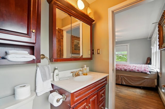 1875 King Ave, Columbus, OH 43212 - ensuite bathroom featuring vanity, wood finished floors, and toilet