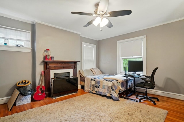 1875 King Ave, Columbus, OH 43212 - bedroom featuring wood finished floors, multiple windows, ornamental molding, baseboards, and ceiling fan