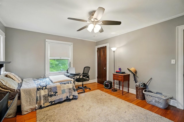1875 King Ave, Columbus, OH 43212 - bedroom with wood finished floors, crown molding, a ceiling fan, and baseboards