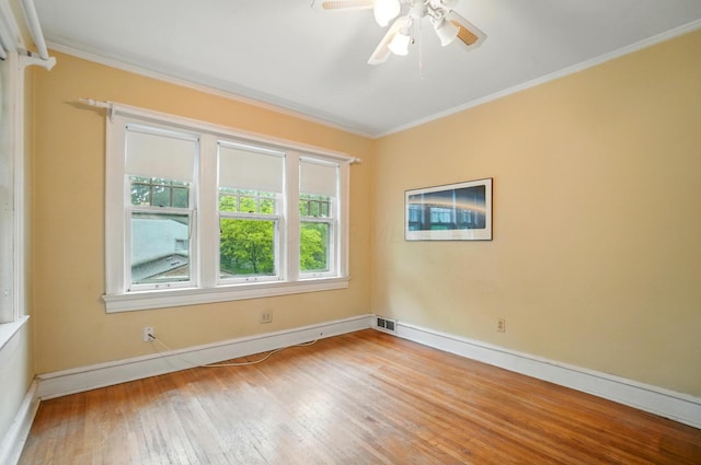 1875 King Ave, Columbus, OH 43212 - unfurnished room featuring crown molding, wood-type flooring, ceiling fan, and baseboards
