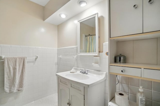 1875 King Ave, Columbus, OH 43212 - bathroom featuring tile walls, vanity, a shower with shower curtain, and a wainscoted wall