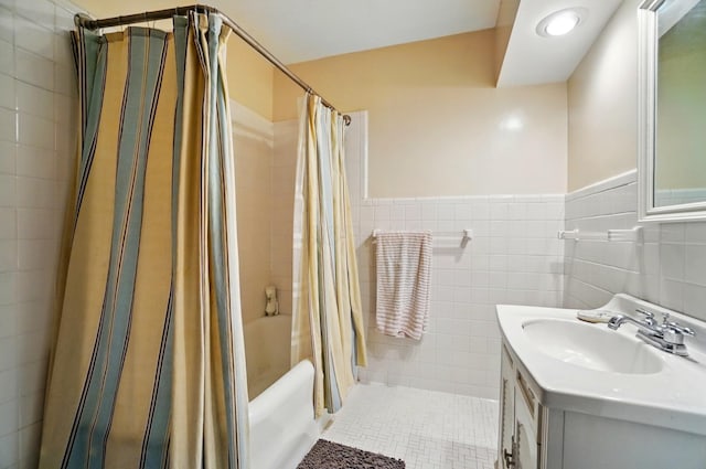 1875 King Ave, Columbus, OH 43212 - full bathroom with vanity, tile walls, shower / bath combo with shower curtain, tile patterned floors, and wainscoting